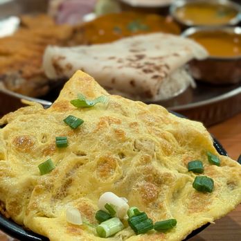 Surmai - Egg hiding the triple schezwan fried rice with the thali in the back - Indian Near Me - Sunnyvale, California Surmai - Egg hiding the triple schezwan fried rice with the thali in the back - Indian Near Me - Sunnyvale, California