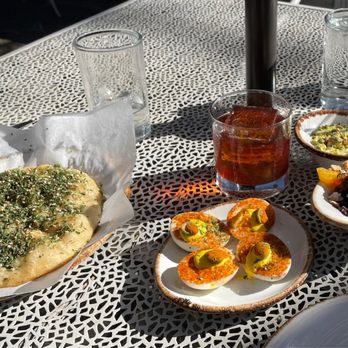 Jardin - Deviled Eggs with Roasted Beets, Pistachio Spinach Dip and Pesto Flat Bread. Paired with a Nutella Cocktail and a Traditional Manhattan. - Mediterranean Near Me - San Antonio, Texas