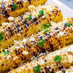 Káktos Tacos - Elotes! Wood-fired corn on the cob, mayo, chile tajin and cotija cheese.