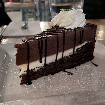 Blue Canoe Waterfront Restaurant - truffle chocolate cake + chantilly cream - Seafood Near Me - Richmond, British Columbia Blue Canoe Waterfront Restaurant - truffle chocolate cake + chantilly cream - Seafood Near Me - Richmond, British Columbia