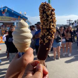 Carousel Cones - Vanilla soft serve Chocolate covered frozen banana with peanuts
