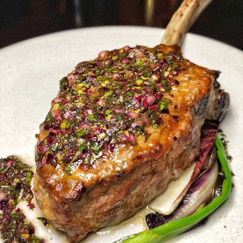 The Library - Veal Tomahawk with winter greens chimichurri - New American Near Me - Las Vegas, Nevada The Library - Veal Tomahawk with winter greens chimichurri - New American Near Me - Las Vegas, Nevada