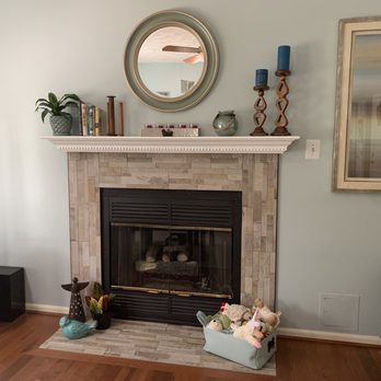 Floormax - a living room with a fireplace and television - Carpeting Near Me - Laurel, Maryland