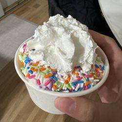 Dairy Quick - vanilla soft serve with whipped cream and rainbow sprinkles