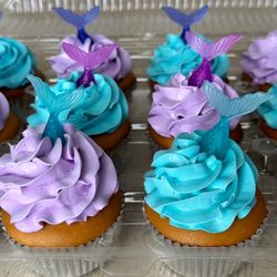 Claudia's Cakes - Mermaid-themed vanilla cupcakes with whipped cream frosting.