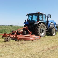 Wickersham Water Hauling - New Holland TL100A with 10' Mower.
