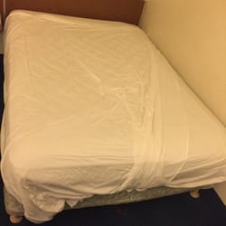Motel 6 - Sheets don't look like this when the bed was made...There was hair on the sheet as well.