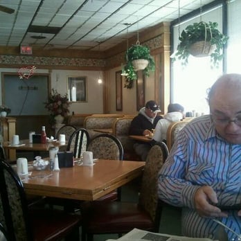 Reflections Family Restaurant - a man sitting at a table - American Near Me - Racine, Wisconsin Reflections Family Restaurant - a man sitting at a table - American Near Me - Racine, Wisconsin