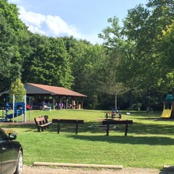 Delta Mills Park - The view of the pavilion from parking lot. Not sure if that seating area is for bonfires or there used to be flowers in there