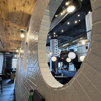 Blackwall Hitch - Bar area high top seat by the wall - New American Near Me - Baltimore, Maryland