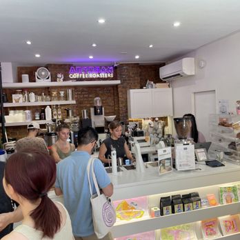 Artbean Coffee - a group of people in a coffee shop - Art Galleries Near Me - New York, New York