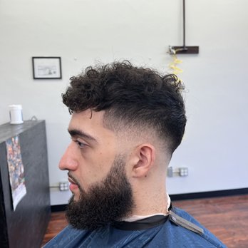 Alpha Fades Barber Studio - Mid skin fade haircut with shear texturing on top - Barbers Near Me - St. Cloud, Florida