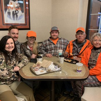 McDonald's - a group of people sitting at a table - Burgers Near Me - Pierre, South Dakota