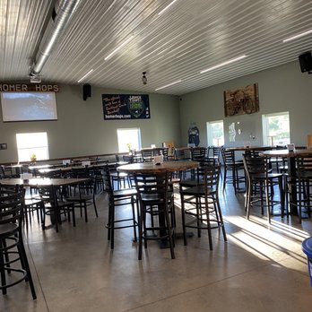 Homer Hops Brewing - tables and chairs in a large room - Breweries Near Me - Cortland, New York