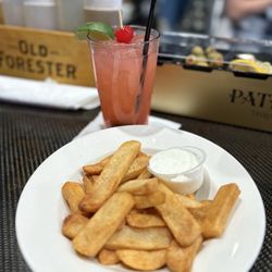 SkyBox Grill & Tavern - Fruity drink and fries
