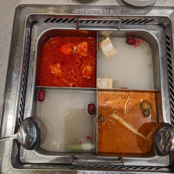 Haidilao Hotpot Katy - Broths (Clockwise from top-left: Tomato, Pork Bone, Tomyum, Chicken Bone and Pork Stomach) - Seafood Near Me - Katy, Texas