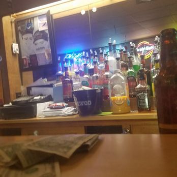 Porky's Bar - a bottle of beer on a bar counter - Nightlife Near Me - Saint Paul, Minnesota Porky's Bar - a bottle of beer on a bar counter - Nightlife Near Me - Saint Paul, Minnesota