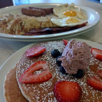 Lincoln Square Pancake House - Bloomington - Platter with blueberry pancakes. - Breakfast & Brunch Near Me - Bloomington, Indiana