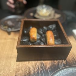 Field Restaurant - What we have here is a bread thing that was toasted on hot rocks as a part of amuse bouch.