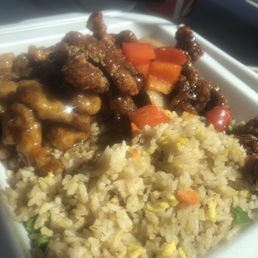 Orange chicken, bejinn beef, and rice Orange chicken, bejinn beef, and rice