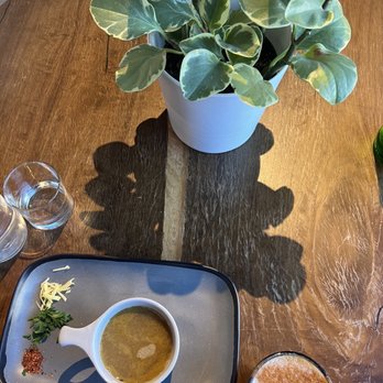 Nest At Nurture - a bowl of soup and a cup of coffee - Juice Bars & Smoothies Near Me - Denver, Colorado
