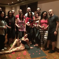 Bombshell Yoga & Wellness Studio - Valentine's Day couples yoga at Bombshell Yoga & Wellness Studio.