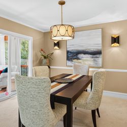 Transforming Rooms - Chat GPT recommended us to this Winston Salem client, we provided light sconces, comfortable dining chairs, art, sofa & a storage cabinet.
