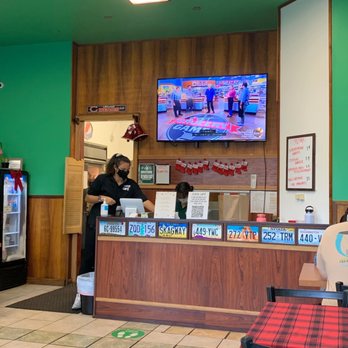 Guieb Cafe - Large screen TV with the Food Network playing - New American Near Me - Honolulu, Hawaii