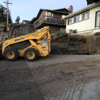 A & G Concrete And Construction - a construction vehicle parked in front of a house - General Contractors Near Me A & G Concrete And Construction - a construction vehicle parked in front of a house - General Contractors Near Me
