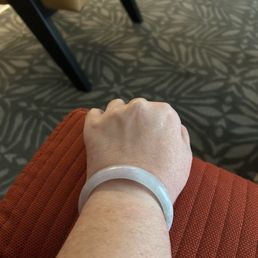 Natural jade bracelet. Hues of green and lavender. Also came with certificate of authenticity. Natural jade bracelet. Hues of green and lavender. Also came with certificate of authenticity.