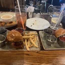 Onion ring appetizer and burger with maple and blue cheese split Onion ring appetizer and burger with maple and blue cheese split