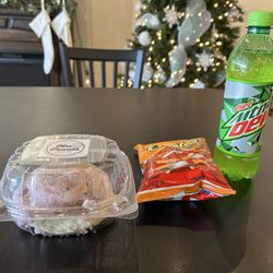Mrs Powell’s Bakery - Huckleberry Cinnamon Roll Side Items: Cheetos & Diet Mtn Dew