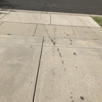 Grease Monkey - Oil leak on driveway - Oil Change Stations Near Me - Brighton, Colorado
