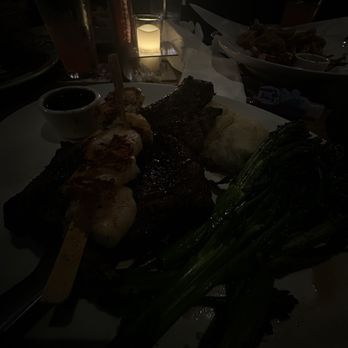 Yard House - 20oz Bone-in Ribeye with grilled shrimp skewer 20oz Bone-in Ribeye with grilled shrimp skewer - New American Near Me - Atlanta, Georgia Yard House - 20oz Bone-in Ribeye with grilled shrimp skewer 20oz Bone-in Ribeye with grilled shrimp skewer - New American Near Me - Atlanta, Georgia
