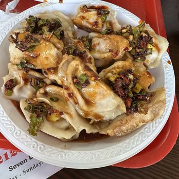 Tasty Dumpling - We got pork dumplings we added hot sauce, dumplings sauce abs hot chili oil with chives on it takes the dumplings to a serendipity flavor - Chinese Near Me - New York, New York