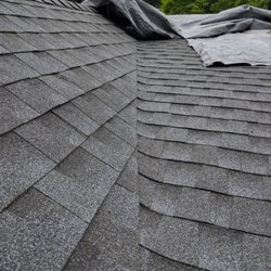 Mighty Dog Roofing - Close-up of a newly installed architectural shingle roof valley designed for proper water drainage and leak prevention on a residential roof