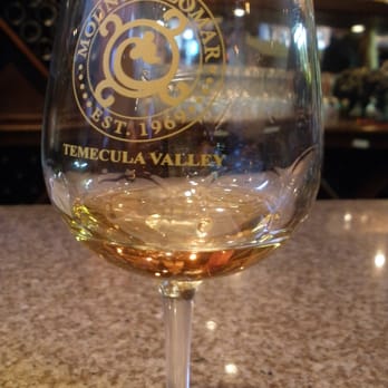 Mount Palomar Winery - A sip of dessert wine inside the tasting room. - Venues & Event Spaces Near Me - Temecula, California Mount Palomar Winery - A sip of dessert wine inside the tasting room. - Venues & Event Spaces Near Me - Temecula, California