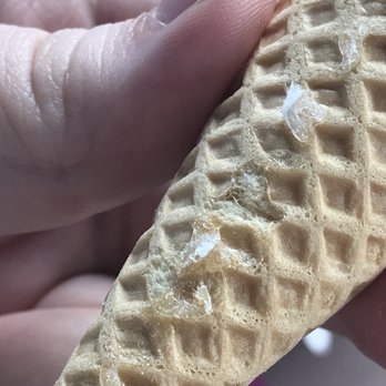 Dunkin' - Clear glue under ripped paper. Literally melted into the cone. - Donuts Near Me - San Jacinto, California