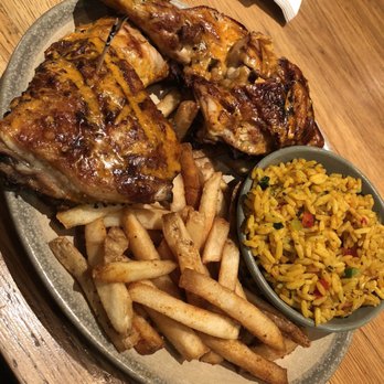 Nando's Peri-Peri - Half chicken extra spicy with Portuguese rice and fries - Portuguese Near Me - Washington, DC, District of Columbia Nando's Peri-Peri - Half chicken extra spicy with Portuguese rice and fries - Portuguese Near Me - Washington, DC, District of Columbia