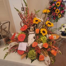 Colonial Florist's arrangement for our dear friend who was a hunter.