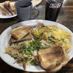 Steven’s Skillet - DENVER OMELET, with smothered and covered hash browns, and sourdough toast. Excellent.