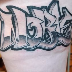 Noble Tattoos & Piercings - Custom lettering and tattoo by Jerry A. Only a couple of hours old! This healed perfectly with proper aftercare!