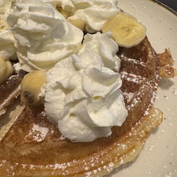 Mosaic Cuisine - Waffle Topped with Powdered Sugar and Bananas - Breakfast & Brunch Near Me - Rockville, Maryland Mosaic Cuisine - Waffle Topped with Powdered Sugar and Bananas - Breakfast & Brunch Near Me - Rockville, Maryland