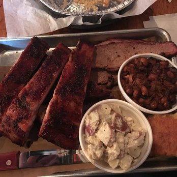 Meat BBQ - Meat platter with brisket, half-rack of ribs, blue cheese and bacon potato salad and BBQ beans. - Barbeque Near Me - Lansing, Michigan Meat BBQ - Meat platter with brisket, half-rack of ribs, blue cheese and bacon potato salad and BBQ beans. - Barbeque Near Me - Lansing, Michigan
