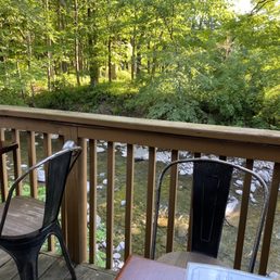 a view of a creek from a deck