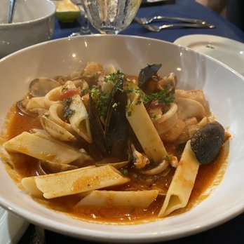 Dolce Italia - Seafood Trenne pasta with spicy red sauce - Italian Near Me - Sarasota, Florida Dolce Italia - Seafood Trenne pasta with spicy red sauce - Italian Near Me - Sarasota, Florida