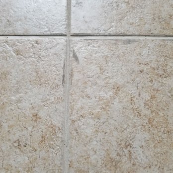 Max & K Carpet Cleaning - The "after" pics. He applied shiny, rubbery silicone caulk to matte grout lines & tile, then undiluted "Viper Venom" to try to remove it! - Carpet Cleaning Near Me