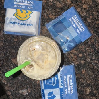 Dutch Bros Coffee - Reusable Totes and my Nitro Cold Brew w SF caramel and white chocolate drizzle and protein milk - they forgot the soft top. - Juice Bars & Smoothies Near Me - Rialto, California Dutch Bros Coffee - Reusable Totes and my Nitro Cold Brew w SF caramel and white chocolate drizzle and protein milk - they forgot the soft top. - Juice Bars & Smoothies Near Me - Rialto, California