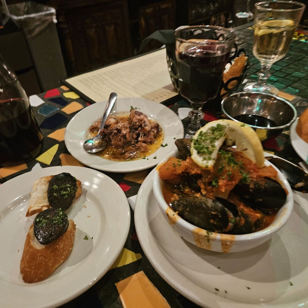 Viva Madrid! - Blood sausage on toast, "spicy" garlic tomato mussels and pimento squid/calimari - Spanish Near Me - Claremont, California Viva Madrid! - Blood sausage on toast, "spicy" garlic tomato mussels and pimento squid/calimari - Spanish Near Me - Claremont, California