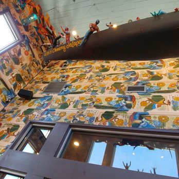 Chuy's - Little luchalebras dangling from a canoe on the ceiling! The cutest interior and ambiance @ Chuy's Tex-Mex, Lutz, FL - Tex-Mex Near Me - Lutz, Florida